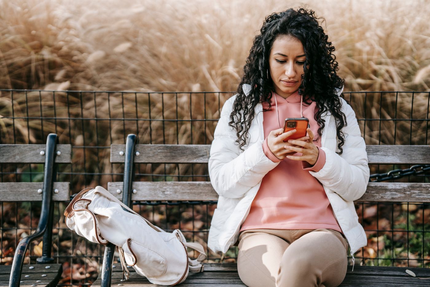Adult quietly reading and replying to a text message on a smartphone